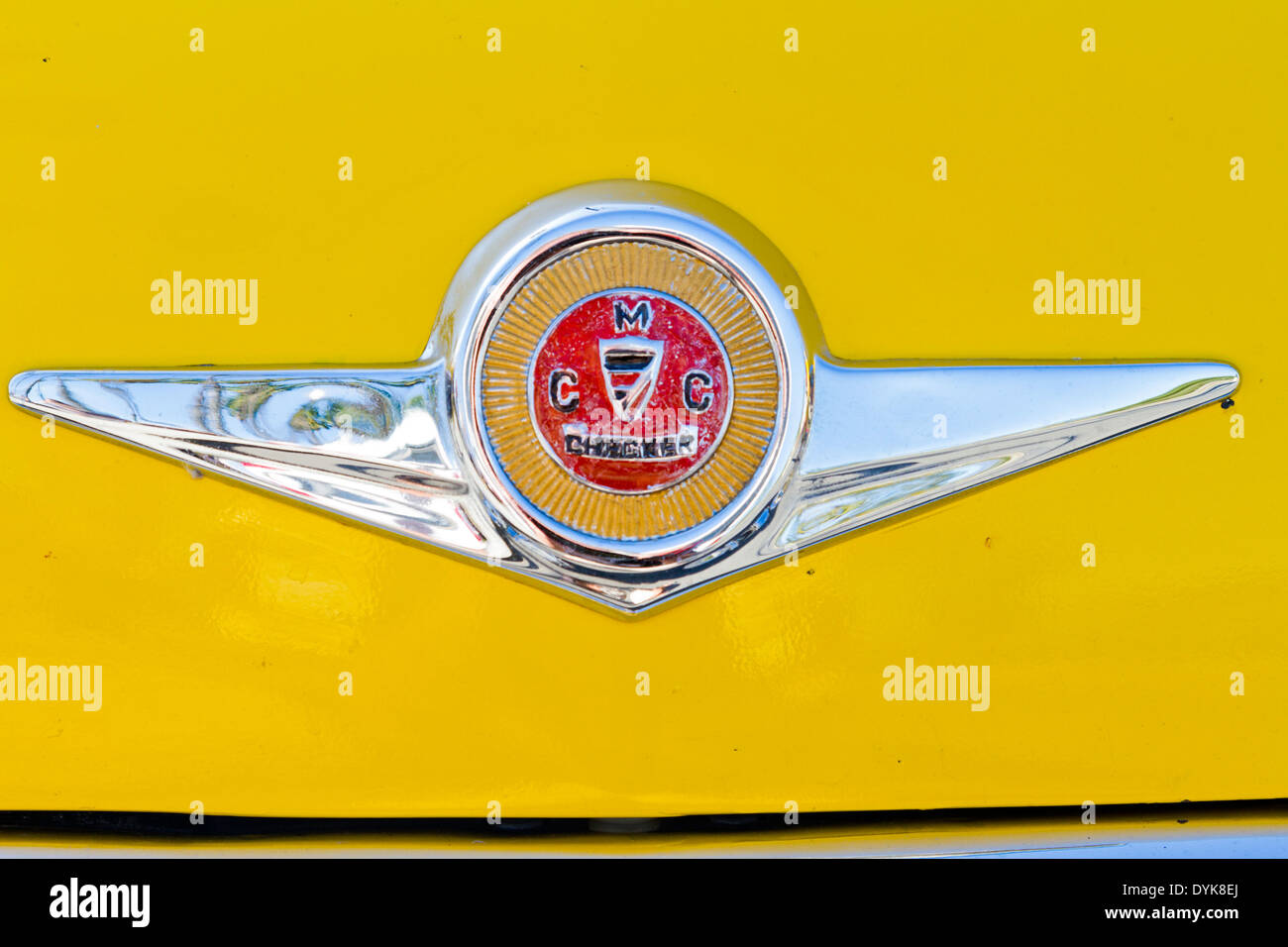 closeup-macro-picture-of-badge-on-front-of-a-yellow-1971-checker-marathon-DYK8EJ.jpg