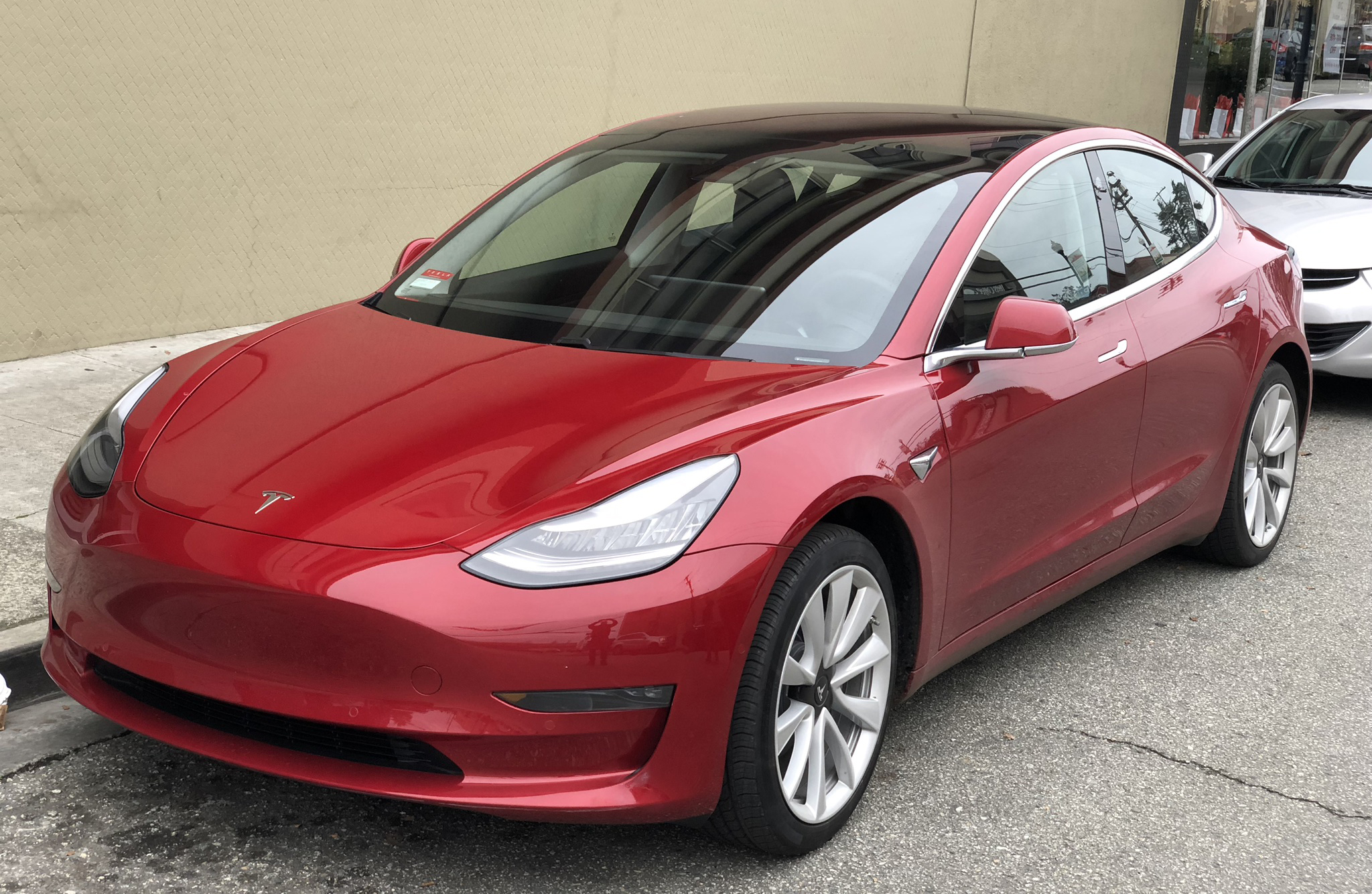 Tesla_Model_3_parked%2C_front_driver_side.jpg